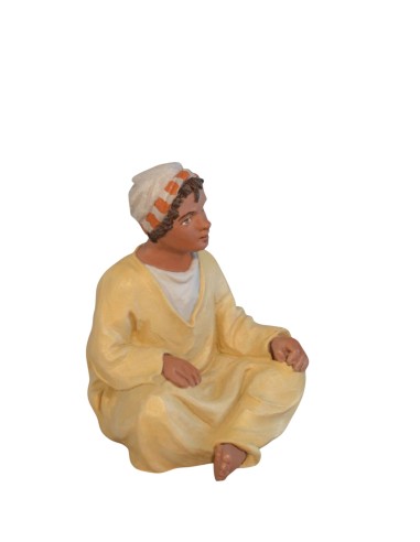 14115 Niño sentado moruno. Fabricado en pasta cerámica Italiana.