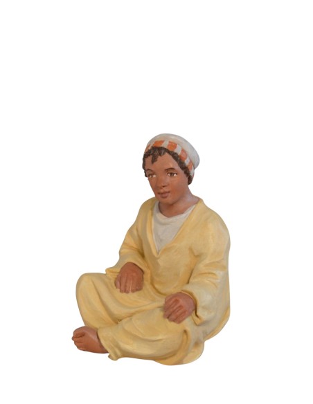 14115 Niño sentado moruno. Fabricado en pasta cerámica Italiana.