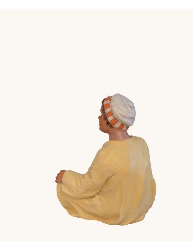 14115 Niño sentado moruno. Fabricado en pasta cerámica Italiana.