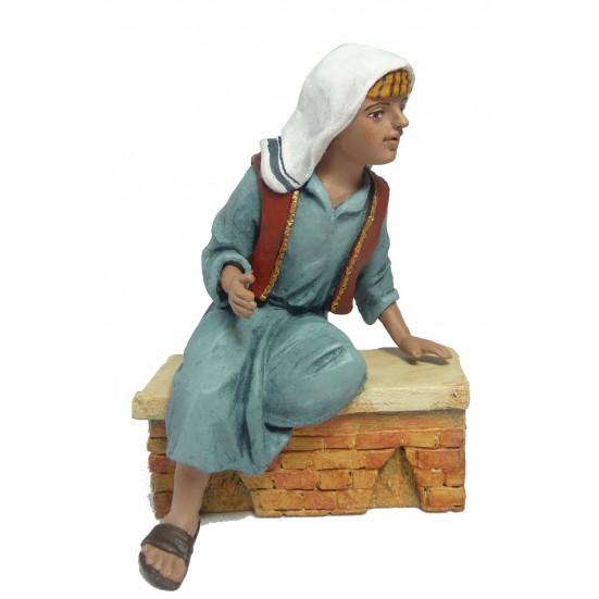 Niño sentado recostado. Fabricado en pasta cerámica Italiana