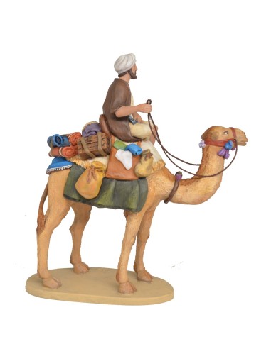 Pastor a camello con carga