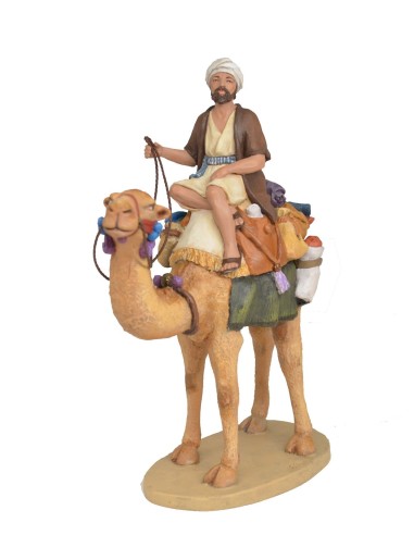 Pastor a camello con carga
