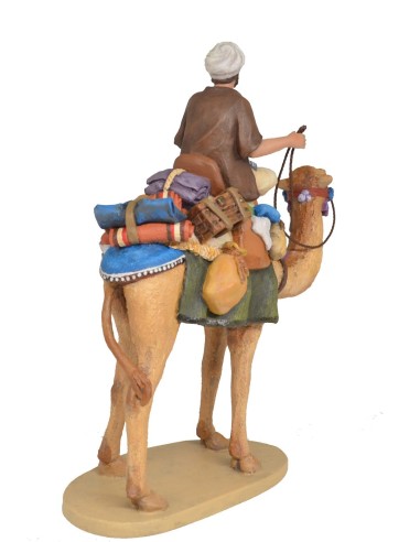 Pastor a camello con carga