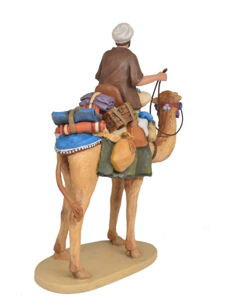 Pastor a camello con carga