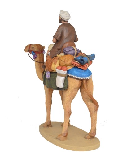 Pastor a camello con carga