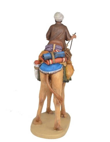 Pastor a camello con carga