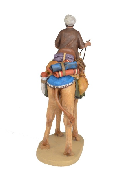 Pastor a camello con carga