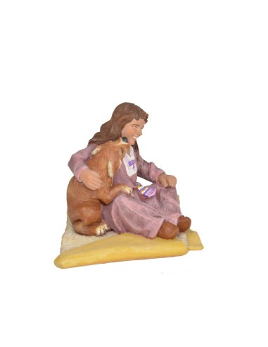 Niña sentada con perrito lamiendo la mejilla